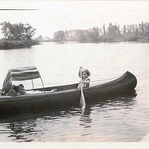 Al And Jane Breed Canoeing On River